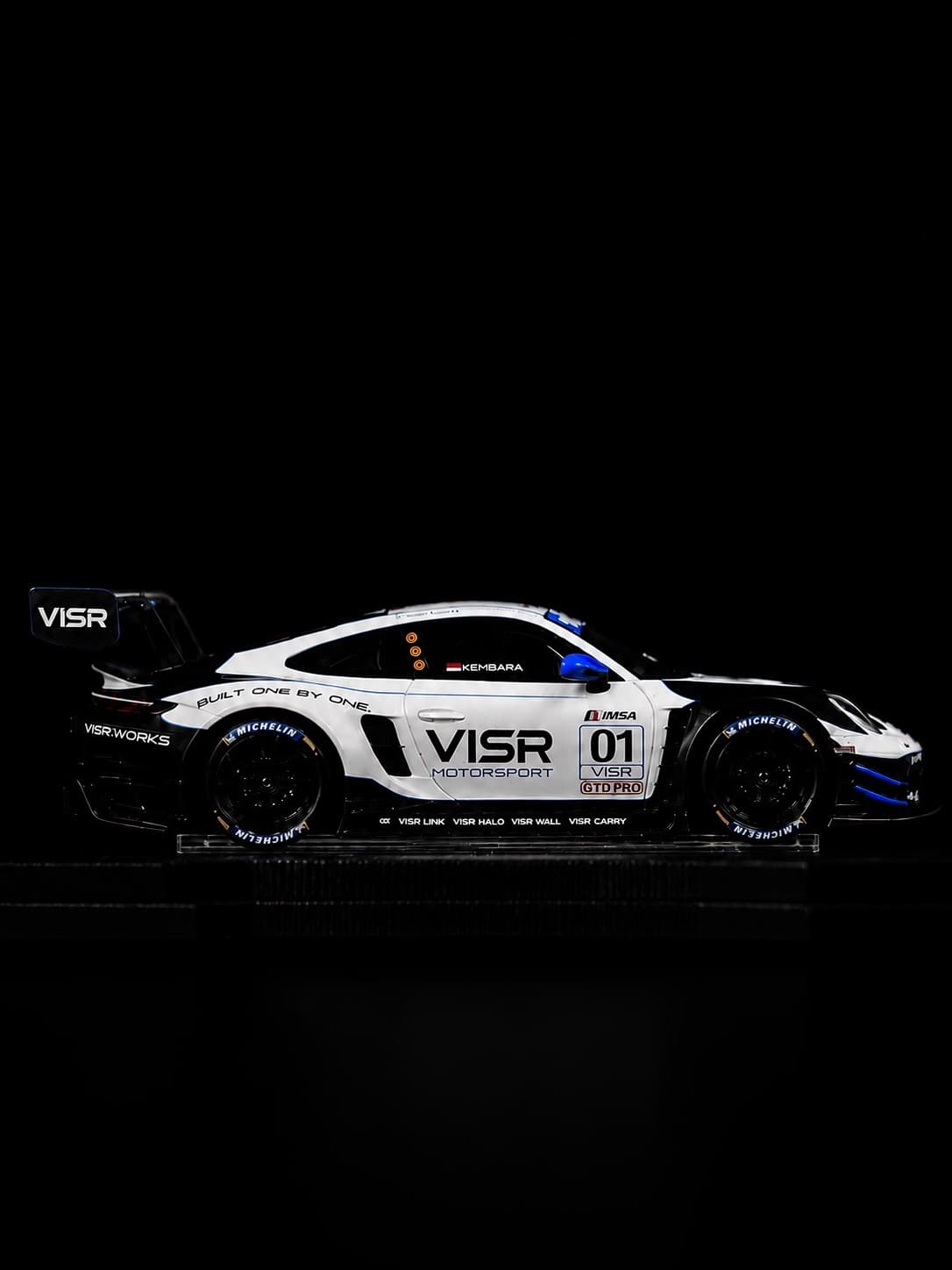 A complete diecast car held in the locked position by VISR Link